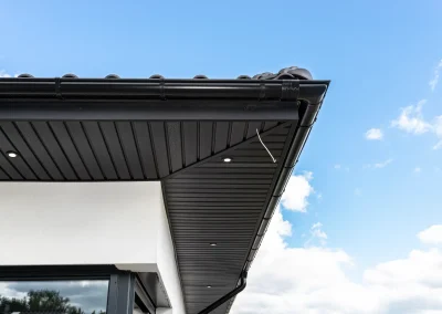 Black fascia, soffit and guttering installed on residential roofline
